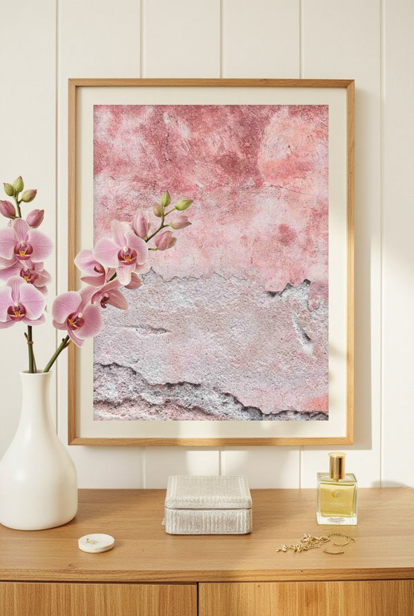 Fine art photography of Italian pink plaster texture, framed abstract wall art print styled on a console with orchids and perfume bottle.
