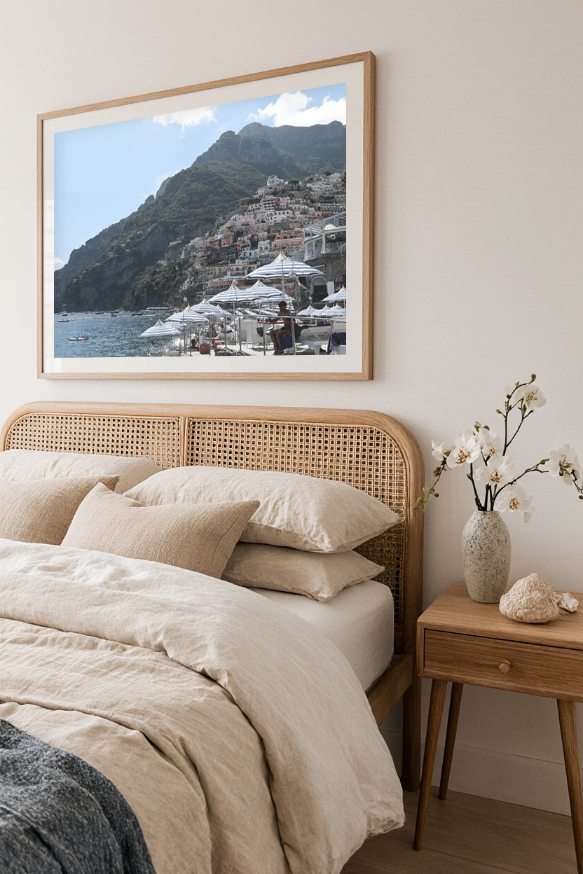 Bedroom with a framed picture of a La Scogliera Beach Club in Positano, Italy above the bed.